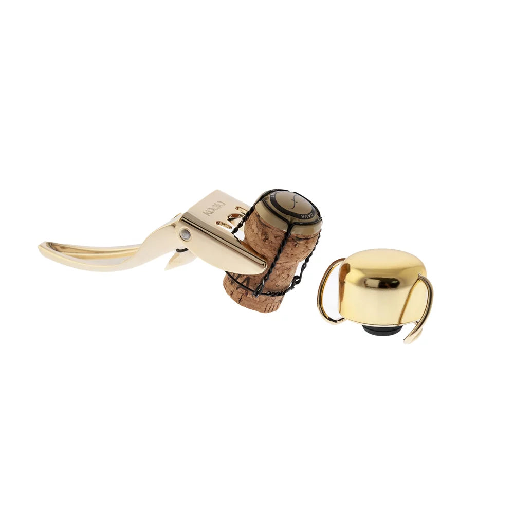 Set Champagne Lover, composto da pinza e stopper, nella versione color oro.